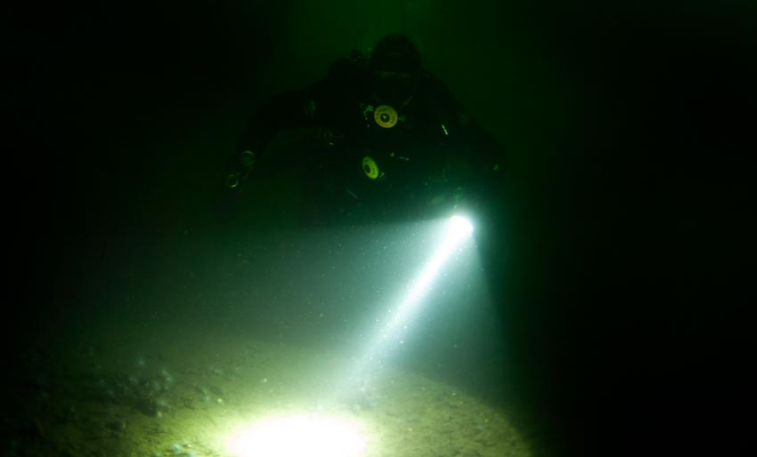 Scuba diver with torch